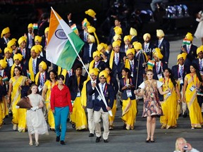 One of these things is not like the other -- and the appearance of a red-and-green-clad woman identified as Madhura Honey among India's athletes in the Opening Ceremony has caused a furor.