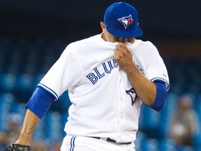 Toronto Blue Jays pitcher Ricky Romero covers his face during his disastrous start against the Oakland Athletics on Wednesday.
