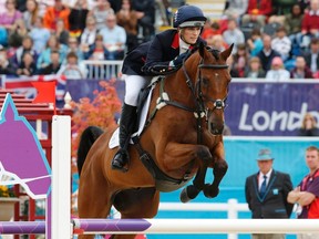 Britain's Zara Phillips, riding High Kingdom, clears a fence during the eventing jumping equestrian event at the London 2012 Olympic Games, July 31, 2012. (MIKE HUTCHINGS/Reuters)