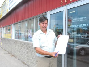 Portage la Prairie MLA Ian Wishart with the St. Ambroise beach petition sent to the provincial government. (Portage Daily Graphic file photo)