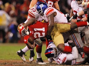 San Francisco 49ers running back Frank Gore is brought down by New York Giants defensive end Jason Pierre-Paul in the third quarter during the NFL NFC Championship game in San Francisco, California in January. (REUTERS)