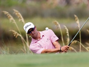 Unfortunately, the 2012 British Open won't be remembered for Ernie Els' victory, but instead Adam Scott (above) coughing up a four-shot lead on the last four holes. (MATT SULLIVAN/Reuters)