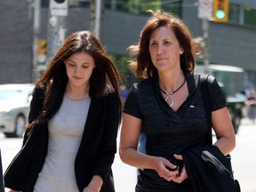 Sonja Plunkett (R) the widow of slain Det. Rob Plunkett leaves Osgoode Hall Courthouse with her daughter Amanda Plunkett on May 23, 2012.   Cop killer Nadeem Jiwa was appealing his sentence. (CRAIG ROBERTSON, Toronto Sun)