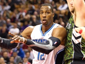 Reports indicate the Magic have re-engaged the Lakers and two other teams in a proposal that would ultimately get Dwight Howard out of Orlando. (Fred Thornhill/Reuters/Files)