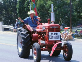 Haldimand Norfolk MPP Toby Barrett drove his tractor in last year's Simcoe Friendship Festival parade. The parade has been cut from this year's festival lineup. (SARAH DOKTOR Simcoe Reformer file photo)