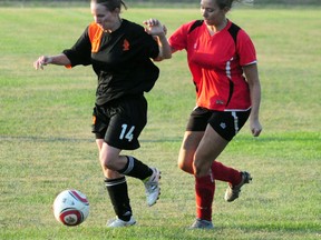 Ashley Williams of the Portage Blaze jostles for position with a Heat opponent during a 5-1 win at Republic of Manitobah Park on Monday night. (Dan Falloon/Portage Daily Graphic)