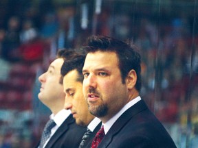 Spits head coach Bob Boughner (centre) is pictured here in the Sault with associate coach Bob Jones (right) and assistant D.J. Smith.
