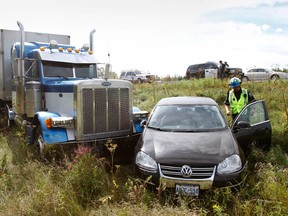 The OPP and local paramedics respond to a collision on Highway 401 near Belleville, Ont. in August 2012. - FILE/JEROME LESSARD/THE INTELLIGENCER/POSTMEDIA NETWORK