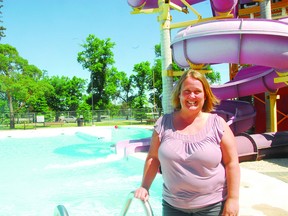 Monica Chorney, aquatics manager with Portage Regional Recreation Authority (PRRA), stands next to the outdoor water park, which has managed to attract visitors from outside the city and RM to Portage. (FILE PHOTO)