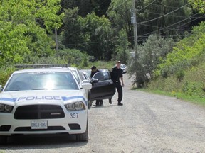 Peel Regional Police officers spent the weekend searching for human remains in a park in Mississauga after a head, two hands and a foot were discovered there last week. (IAN ROBERTSON, Toronto Sun)