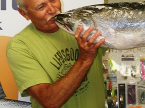 That’s a kiss worth $14,000. Andy Varga of Mar, Ontario plants one on the 18.83 lbs. Chinook Salmon that earned him the top prize at the 29th Annual Chantry Chinook Classic Salmon Derby in 2012. The 30th annual event runs July 27 to Aug. 11, 2013. (QMI FILE)