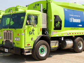 Green for Life garbage trucks lined up and ready for privatized garbage collection in Toronto west of Yonge St. to the Humber River.