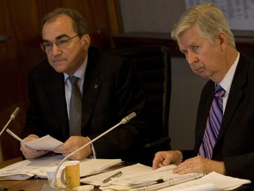 Former TCHC CEO Len Koroneos, left, listens in at an April 2011 meeting. Documents obtain by the Toronto Sun reveal that Koroneos walked away with at least $461,000 and as much as $600,000 for 18 months work. Then TCHC chairman Case Ootes, right, said he could not comment. (Jack Boland/Toronto Sun files)