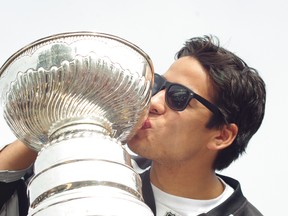 Jordan Nolan kisses the Stanley Cup during a visit to the Garden River Bingo Hall.