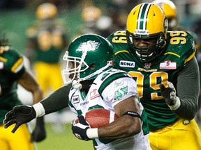 Eskimos defensive lineman Jermaine Reid, shown here in a game last November, had surgery over the off-season to repair a torn labrum, and is back with the team while rehabbing his shoulder. (Edmonton Sun file)