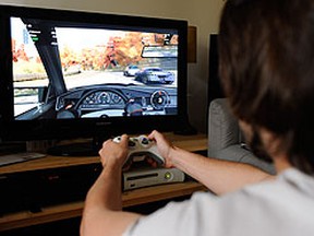 A young man is seen playing Xbox. (Postmedia file photo)