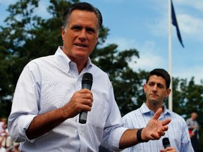 U.S. Republican presidential candidate and former Massachusetts Governor Mitt Romney (L) and vice-presidential candidate, U.S. Representative Paul Ryan (R-WI), answer questions from audience members during a town hall meeting campaign stop in Manchester, N.H., August 20, 2012.   REUTERS/Brian Snyder