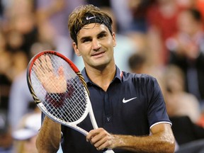 Roger Federer of Switzerland celebrates after defeating Donald Young of the U.S. during their opening night men's singles match at the U.S. Open tennis tournament in New York, August 27, 2012. (REUTERS/Bill Kostroun)