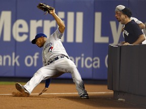 Blue Jays right fielder Moises Sierra stumbles as he catches a foul ball on Monday at Yankee Stadium. Jays manager John Farrell says that Sierra will be getting lots of playing time with Jose Bautista unavailable. (JEFF ZELEVANSKY/Getty Images/AFP)