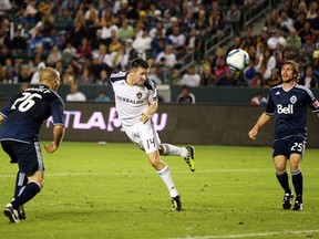 Robbie Keane of the Los Angeles Galaxy heads in a goal against the Vancouver Whitecaps during their MLS match at The Home Depot Center on Sept. 17, 2011 in Carson, Calif. (Photo by Victor Decolongon, Getty Images)