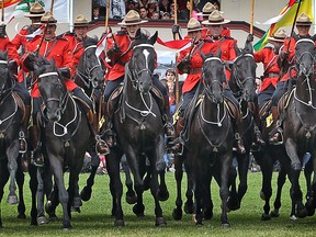 OTTAWA, ONT. -JULY 1, 2010- The RCMP Musical Ride performs the famous charge on the west lawn of Parliament Hill just prior to the noon hour Canada Day festivities, July 1, 2010.  (Photo by Wayne Cuddington, Ottawa Citizen.)