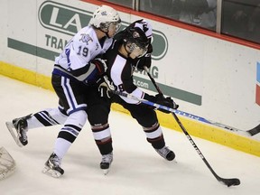 Vancouver Giants blueliner Blake Orban (right) in action against Logan Nelson of the Victoria Royals during a WHL game earlier this month at the Pacific Coliseum. (Photo by Gerry Kahrmann, PNG)