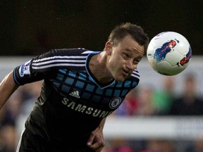 John Terry of Chelsea heads the ball during an England Premier League soccer match vs. Queens Park Rangers at Loftus Road in London on Oct. 23, 2011. (Photo by Adrian Dennis, AFP/Getty Images)