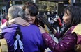 VANCOUVER, B.C.: OCTOBER 17, 2011 - Fresh grief from a similar tragedy with the announcement that Prince George RCMP have a suspect in the Highway 16 murders causes Cee Jay Julian(C) of Ft. St. James to be consoled by elders at the first nations healing circle supporting the families of the missing and murdered women in the intersection of  Granville and Georgia  Monday, October 17, 2011 in Vancouver, B.C.  ( Ian Lindsay /  PNG staff photo)