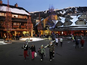 Skiers stroll down through Whistler Village after a  beautiful day. Mark van Manen/Vancouver Sun.