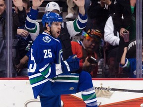 VANCOUVER, CANADA - DECEMBER 26: Andrew Ebbett #25 of the Vancouver Canucks celebrates after scoring against the Edmonton Oilers during the first period in NHL action on December 26, 2011 at Rogers Arena in Vancouver, British Columbia, Canada.  (Photo by Rich Lam/Getty Images)