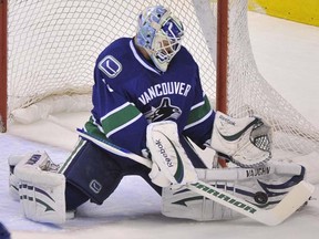 Vancouver Canucks goalie Cory Schneider blocks a shot against the Columbus Blue Jackets in NHL action at Rogers Arena on Nov. 29, 2011. (Photo by Ian Lindsay, PNG)