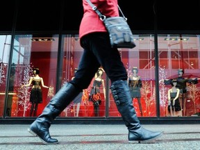 VANCOUVER , BC., November 8, 2011 -- Commuters walk past Christmas shopping displays at Sears on Granville St. in Vancouver.

(Nick Procaylo/PNG)