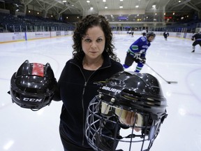 Vancouver , BC.  December 6,  2011 As of January 1st. 2012  Burnaby is mandating that people enrolled in all their city skating lessons must wear CSA-approved SNOW and ICE helmets.  Arlene Huges program coordinator, shows the correct CSA helmets inside the Bill Copeland arena in Burnaby on December6 2011.

  (Mark van Manen/PNG Staff

see  Vancouver Sun/ Jeff Lee Cityside -stories )

00057833A
