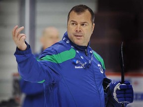 Vancouver Canucks head coach Alain Vigneault directs his troops. (Photo by Wayne Leidenfrost, PNG)