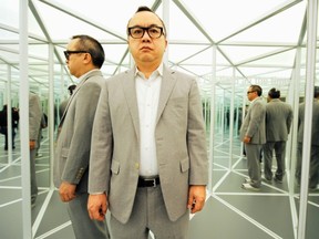 Will the real Ken Lum please stand up? Last year, The Vancouver Sun took this image of Lum standing in his installation Mirror Maze with 12 Signs of Depression at the Vancouver Art Gallery. Glenn Baglo / PNG