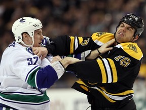 Elsa/Getty Images
Nathan Horton of the Boston Bruins and Dale Weise of the Vancouver Canucks fight in the first period on January 7, 2012 at TD Garden in Boston.