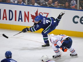 EDMONTON, CANADA - OCTOBER 25: Newly-acquired David Booth #7 of the Vancouver Canucks takes a shot on net against the Edmonton Oilers on October 25, 2011 at the Rexall Place in Edmonton, Alberta, Canada. (Photo by Dale MacMillan/Getty Images)