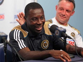Freddy Adu gets a pat on the back from his new coach of the Philadelphia Union, Peter Nowak, during a news conference in Chester, Penn., on Aug. 12, 2011. Adu was drafted to much acclaim in 2004, but has gone on to have a journeyman career — pointing out the unpredictable (to be charitable) nature of the MLS “SuperDraft.” (Photo by Michael Bryant, MCT)