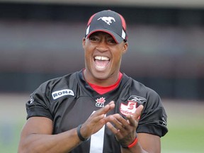 ‘Smiling Hank’ Burris won’t be grinning too much in Cowtown any more as he moves east to join the Hamilton Tiger-Cats. Henry Burris goes from oldest quarterback in the West to the No. 2 senior in the East. (Photo by Ted Rhodes, Postmedia News)