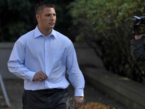 SURREY, B.C.: OCTOBER 26, 2009 -- Jarrod Bacon leaves the Surrey courthouse, October 26th, to join his parents for lunch. The parents are to be called by Crown Counsel concerning their son Jamie's trial.  (Ward Perrin / Vancouver Sun) (For story by Bolan) [PNG Merlin Archive]