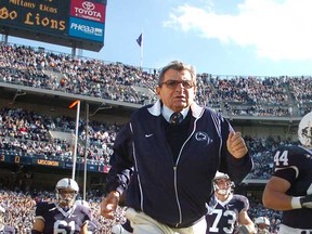 Legendary Penn State football coach Joe Paterno runs out onto the field prior to a 2007 game. He died Sunday at the age of 85. (Photo by Nabil K. Mark, MCT)