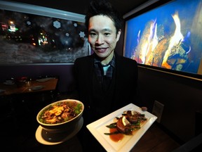 VANCOUVER, BC.: DECEMBER 16, 2011-Toby Tseung, owner of Kin Resto + Bar with Bacon wrapped scallops with miso sake sauce and Budha Bowl,  on  December 16, 2011,  in Vancouver, B.C.  Mia Stainsby  story.  (Steve Bosch/PNG)