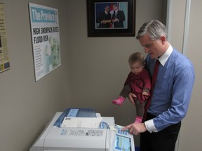 With the help of his daughter Fintry, Barry Penner faxes his letter of resignation.