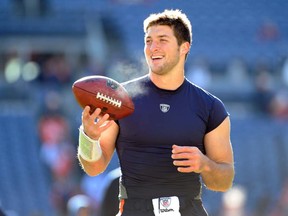 They're even singing songs about him now. Singer John Parr has rededicated his 80s hit, St. Elmos' Fire, to quarterback and football  miracle worker Tim Tebow of the Denver Broncos. Photo by Garrett W. Ellwood/Getty Images)
