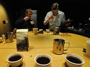 VANCOUVER, BC: JANUARY 18, 2012 - ***UPDATED CAPTION*** David Long and Jesse Neate taste test coffee at Vancouver Sun 100th birthday coffee blend cupping at JJ Beans on Main street in Vancouver, B.C., on January 18, 2012.

(Arlen Redekop photo/ PNG)

(For story by [Mia Stainsby)