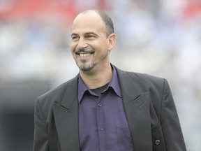 Why is this man smiling? For starters, Canada’s national men’s soccer coach Stephen Hart must be relieved his players are happy to stay in Toronto for all of their upcoming World Cup qualifiers. (Photo by Juan Mabromata, AFP/Getty Images)