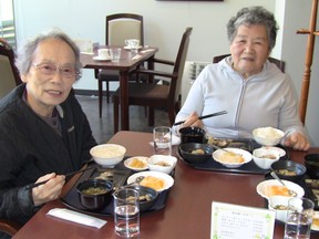 Friends living at the Toyoshikidai Danchi apartment complex in suburban Tokyo eat lunch at a cafe staffed by other seniors.