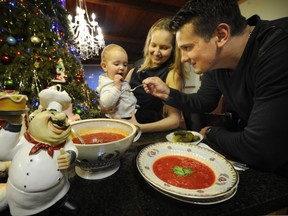 Anton Makarevsky (r) with wife Sasha (c) , and 13 month old  Nikolas (left) have fun with traditional Russian borscht (son's favourite food) in their Richmond home on January 23, 2014.