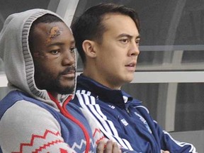 A worse-for-wear Vancouver Whitecaps midfielder Nigel Reo-Coker (left), with Whitecaps senior manager of professional team Joe Jesseau at the team’s practice on Thursday at BC Place Stadium.