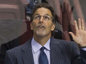 John Tortorella behind the Vancouver Canucks bench during Wednesday's NHL game against the visiting Nashville Predators.